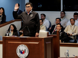 Filipino National Bureau of Investigation Director Melvin Matibag takes an oath before testifying