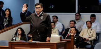 Filipino National Bureau of Investigation Director Melvin Matibag takes an oath before testifying