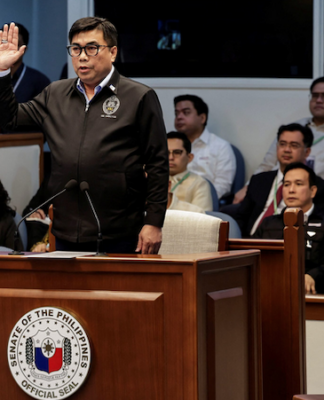 Filipino National Bureau of Investigation Director Melvin Matibag takes an oath before testifying
