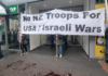 Pro-Palestine and anti-war protesters picket the US Consulate in Auckland during today's "US Invasion Day" rally