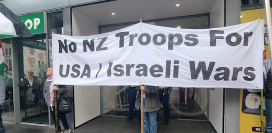 Pro-Palestine and anti-war protesters picket the US Consulate in Auckland during today's "US Invasion Day" rally
