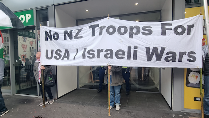 Pro-Palestine and anti-war protesters picket the US Consulate in Auckland during today's "US Invasion Day" rally