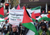 Iranian and Palestinian flags at a New Zealand rally against the war on Iran and the Gaza genocide