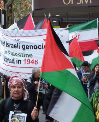 Iranian and Palestinian flags at a New Zealand rally against the war on Iran and the Gaza genocide