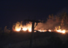 A bushfire comes close to a residential area in Hohola, Port Moresby