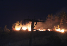 A bushfire comes close to a residential area in Hohola, Port Moresby