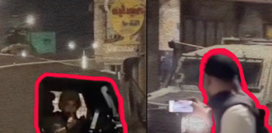 Israeli soldiers facing Palestinian reporters near Nablus