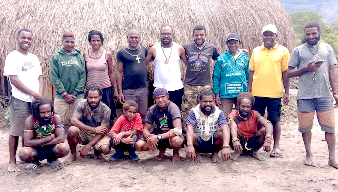 Laurens Ikinia (standing, fifth from left) with members of his extended family