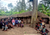 Indonesia at 81 – who owns the land of Papua’s future? The author, Laurens Ikinia, with extended whānau - family (he is pictured fourth from left)