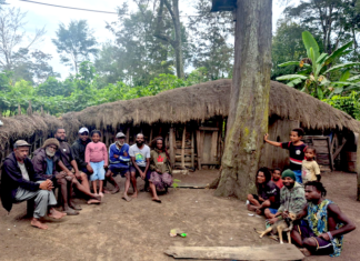 The author, Laurens Ikinia, with extended whānau - family (he is pictured fourth from left)