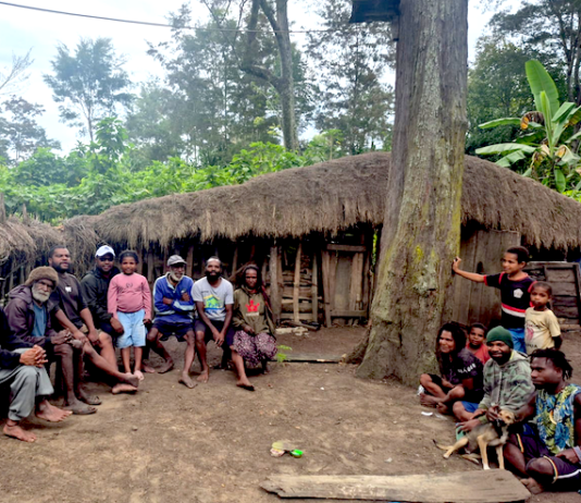 The author, Laurens Ikinia, with extended whānau - family (he is pictured fourth from left)