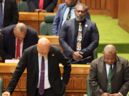 PNG Prime Minister James Marape (right) and MPs "pray for wisdom"