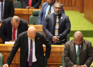 PNG Prime Minister James Marape (right) and MPs "pray for wisdom"