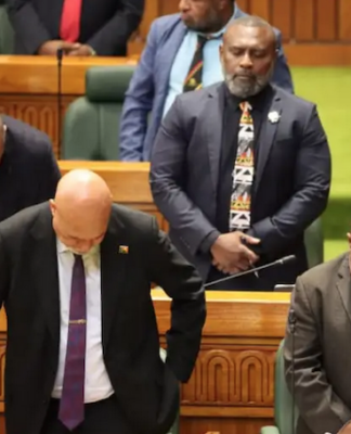 PNG Prime Minister James Marape (right) and MPs "pray for wisdom"