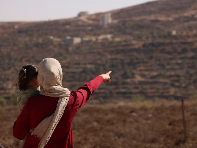 Qusra siege AJ 680wide Trapped Palestinian Refqa Hassan watches as Israeli settlers have besieged her family home