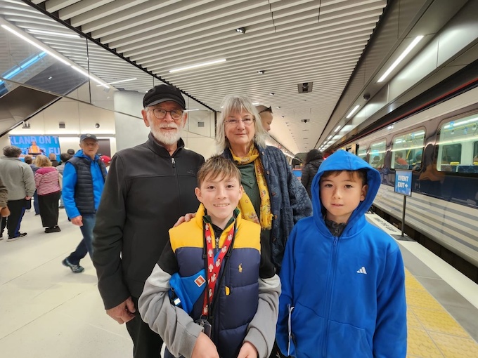 Thirteen-year-old rail enthusiast Aizu Rive, with his brother and grandparents