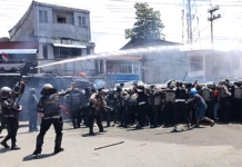 Indonesian police fire water cannon and tear gas on West Papuan demonstrators at Perumnas III Waena, Heram District, Jayapura City, Papua