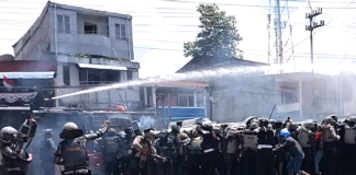 Indonesian police fire water cannon and tear gas on West Papuan demonstrators at Perumnas III Waena, Heram District, Jayapura City, Papua