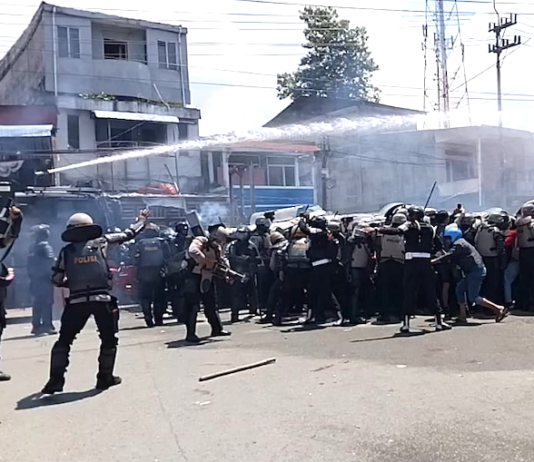 Indonesian police fire water cannon and tear gas on West Papuan demonstrators at Perumnas III Waena, Heram District, Jayapura City, Papua