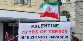 A banner at today's rally in Auckland's Te Komititanga Square