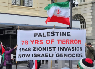 A banner at today's rally in Auckland's Te Komititanga Square