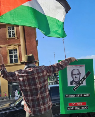 Protester Craig Tynan "shows the flag"