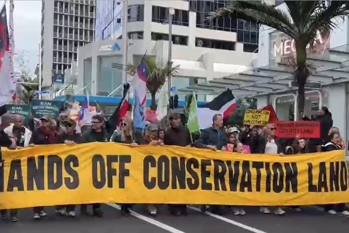 Protesters march down Auckland's Queen St