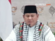 Indonesia's President Prabowo speaking dressed in a keffiyeh