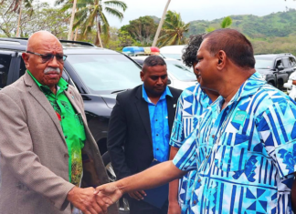 Fijian Media Association general secretary Stanley Simpson (right) greets Prime Minister Sitiveni Rabuka at the 8th Pacific Media Summit in Savusavu