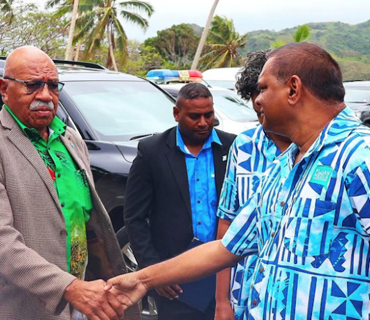 Fijian Media Association general secretary Stanley Simpson (right) greets Prime Minister Sitiveni Rabuka at the 8th Pacific Media Summit in Savusavu