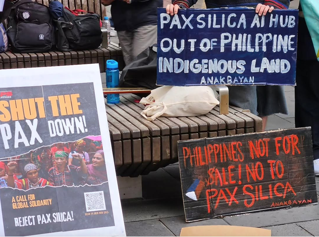 "Shut the Pax down" placards at the Martial Law rally