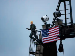 A Greenpeace deep-sea mining protester dressed as US President Donald Trump