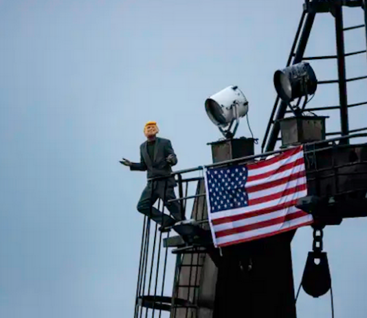 A Greenpeace deep-sea mining protester dressed as US President Donald Trump