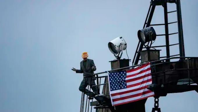 A Greenpeace deep-sea mining protester dressed as US President Donald Trump
