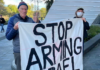 Palestine Solidarity Network Aotearoa (PSNA) national coordinator John Minto and another protester at the New Zealand aerospace summit
