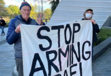 Palestine Solidarity Network Aotearoa (PSNA) national coordinator John Minto and another protester at the New Zealand aerospace summit