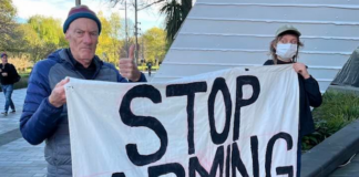 Palestine Solidarity Network Aotearoa (PSNA) national coordinator John Minto and another protester at the New Zealand aerospace summit