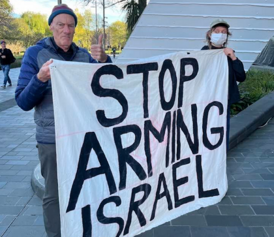 Palestine Solidarity Network Aotearoa (PSNA) national coordinator John Minto and another protester at the New Zealand aerospace summit