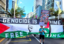 A protester ahead of the Global March for Palestine up Auckland's Queen Street