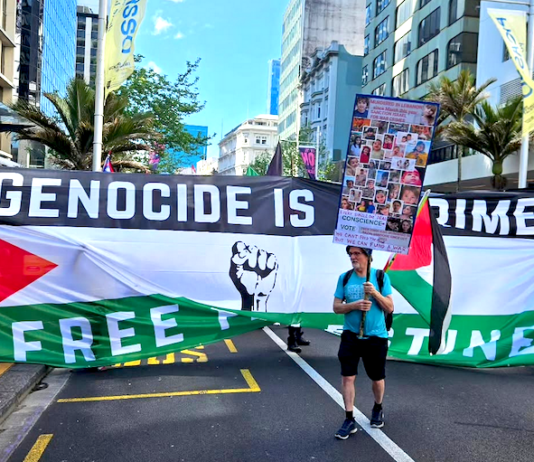 A protester ahead of the Global March for Palestine up Auckland's Queen Street