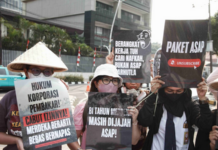 Environmental activists protesting in Jakarta against forest and land fires