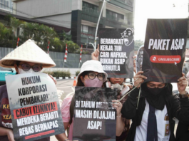 Environmental activists protesting in Jakarta against forest and land fires