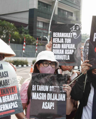 Environmental activists protesting in Jakarta against forest and land fires