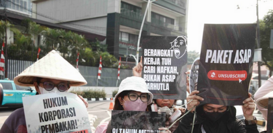 Environmental activists protesting in Jakarta against forest and land fires