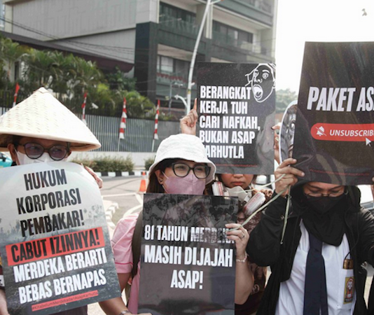 Environmental activists protesting in Jakarta against forest and land fires