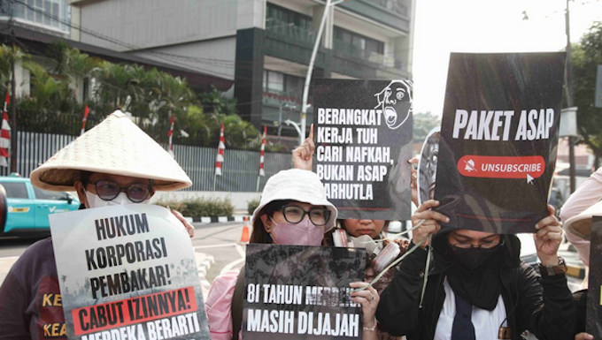 Environmental activists protesting in Jakarta against forest and land fires