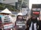 Activists still targeted over Indonesian forest fires and in West Papua, says rights group Environmental activists protesting in Jakarta against forest and land fires