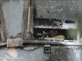Israeli sniper position in a watchtower in the illegally occupied West Bank