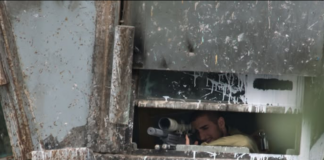 Israeli sniper position in a watchtower in the illegally occupied West Bank