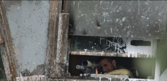 Israeli sniper position in a watchtower in the illegally occupied West Bank